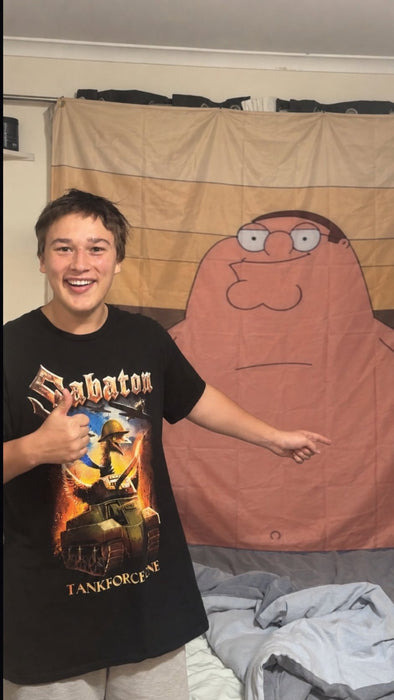 A 3x5 flag hung above a bed with a person beside it for scale