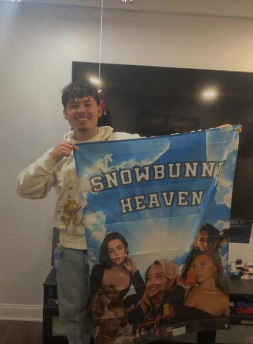 Customer holding his Snowbunny Heaven flag at home