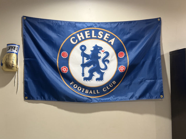 Chelsea FC flag hanging on a bedroom wall