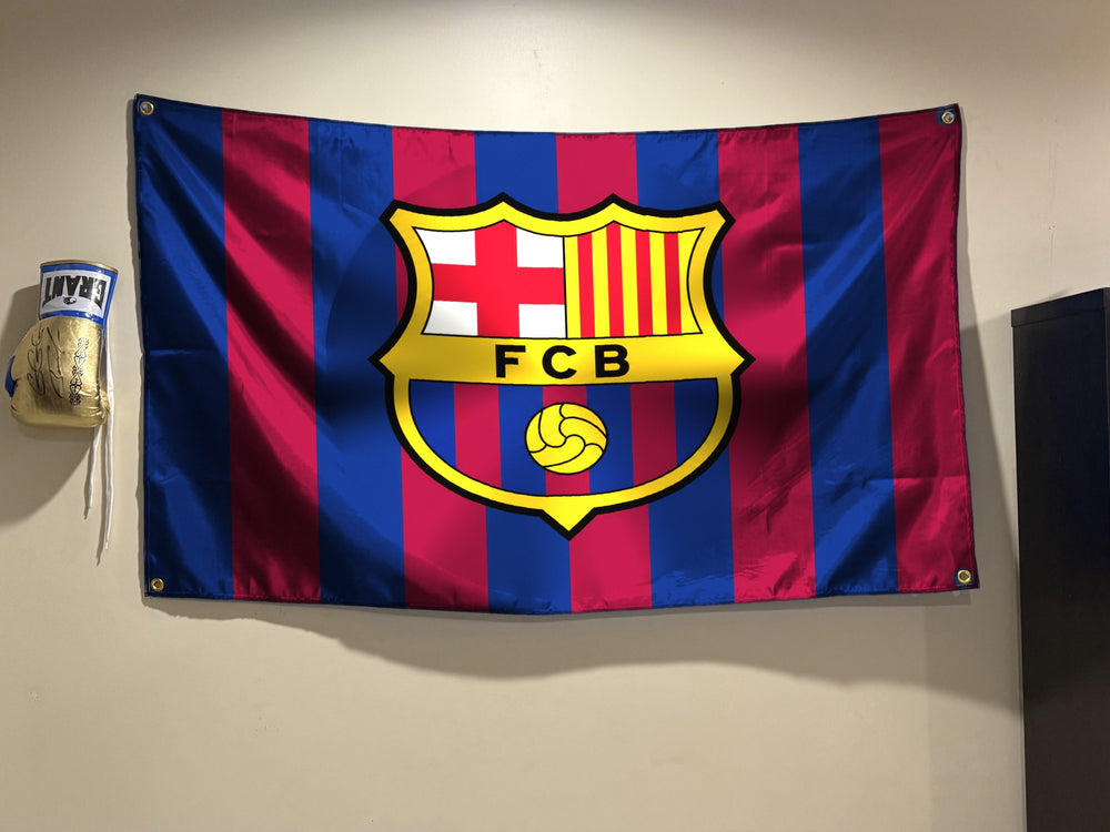 FC Barcelona flag hanging on a bedroom wall