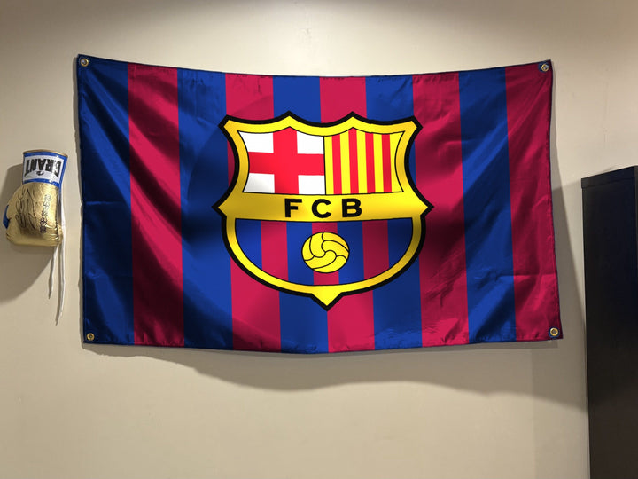 FC Barcelona flag hanging on a bedroom wall