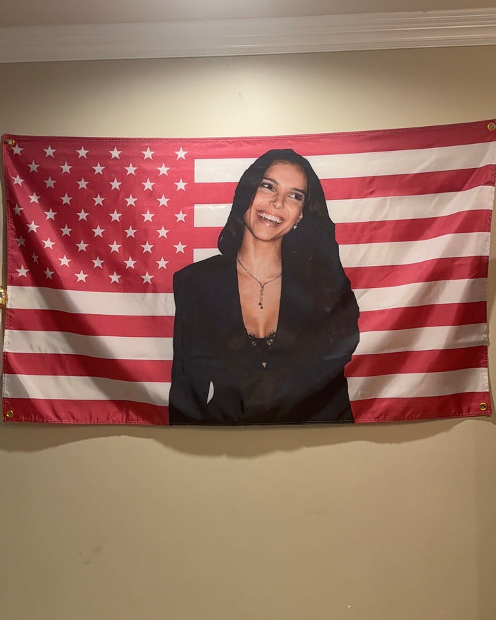 Inde Navarrette pink flag hanging over a bed